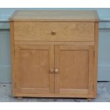 An oak leaf design oak hi-fi cabinet with lift up lid and two small doors to the front on plinth