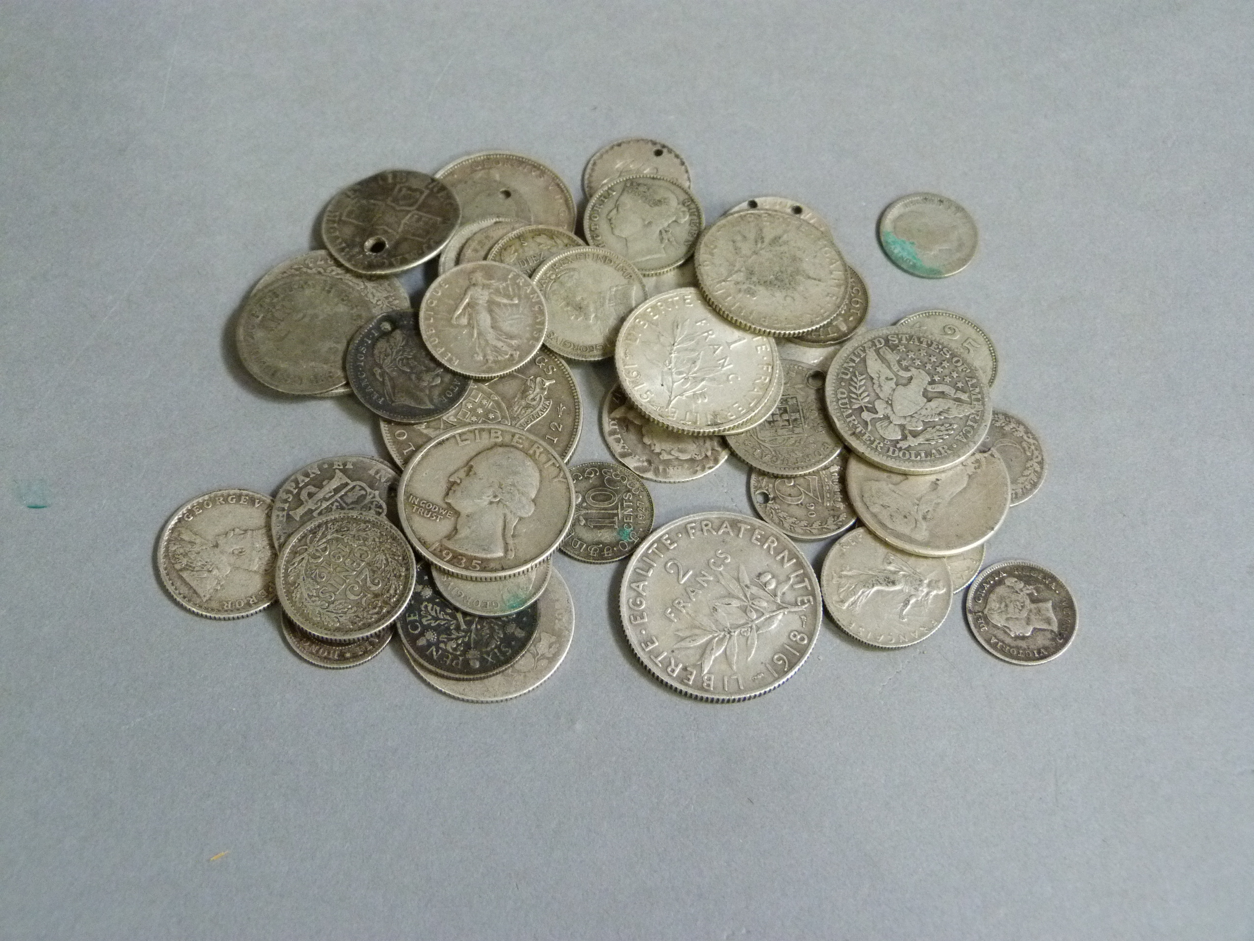 145gm of mainly foreign high grade silver coins