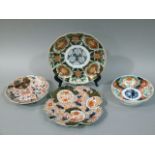 A 19th century Imari leaf shaped plate together with two lobed plates and a saucer dish, all of