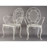 Two white painted metal garden chairs