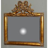 A gilt framed rectangular bevelled wall mirror with ribboned and cherub cresting