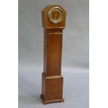 A walnut cased granddaughter clock, glass missing (a/f)