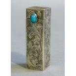 A white metal lipstick case foliate engraved with oval turquoise cabochon to the lid, sprung body