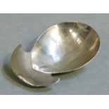 A George III silver caddy spoon of fig shape with crescent handle, 6cm wide by Hester Bateman or