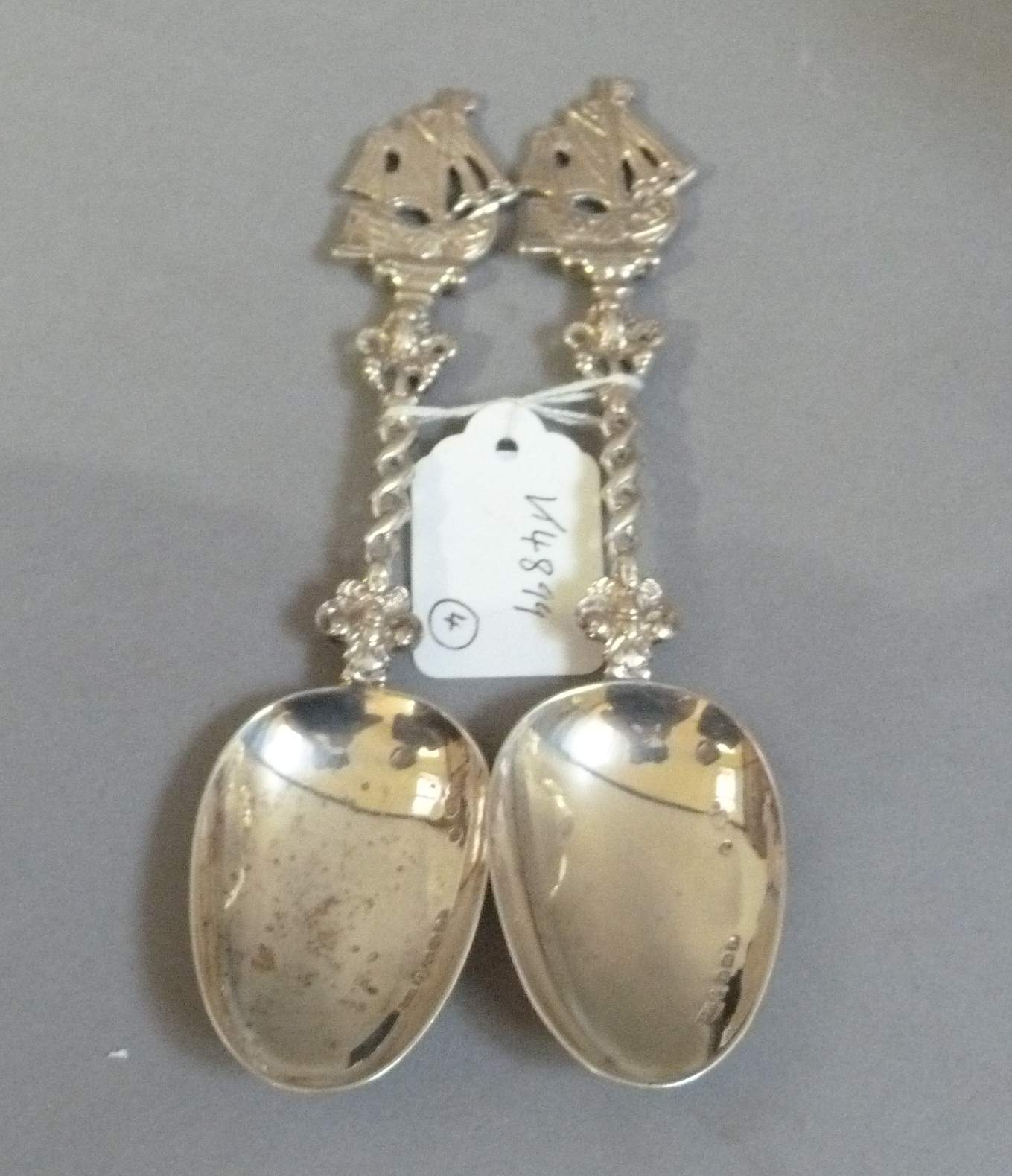 Two 19th century Continental silver spoons with boat cast terminals and pierced interlaced stems,