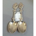 Two 19th century Continental silver spoons with boat cast terminals and pierced interlaced stems,