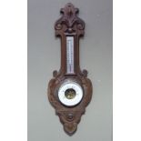 A late Victorian oak framed barometer-thermometer