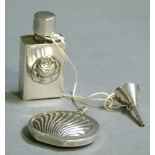 A silver coloured metal spherical flattened scent flask embossed with stylised shell, cylindrical