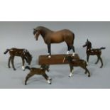 Four models of chestnut foals, Doulton and other makes, together with a resin model of a bay with