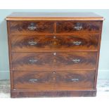 A Victorian figured mahogany chest of two short and three long graduated butterfly veneered drawers,