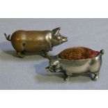 A Victorian silver plated pig vesta, realistically modelled, 5cm long; together with a cast white