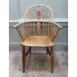 An early 19th century elm and ash low back Windsor chair having a splat and rail back turned