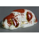 A Royal Doulton paperweight puppy exclusive Royal Crown Derby collectors guild with gilt button