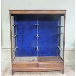 An Edwardian mahogany display cabinet with adjustable supports for glass shelves, two drawers