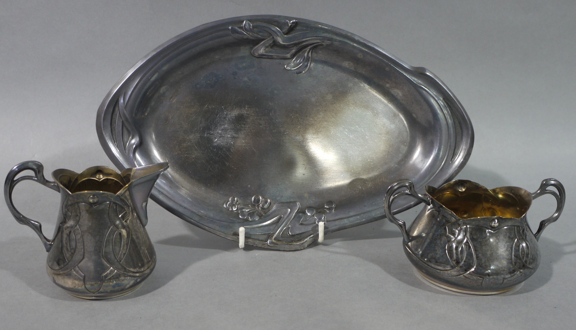 An Art Nouveau three piece silver plated sugar and cream set with tray, each piece with pierced - Image 2 of 2
