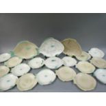 A Shorter pottery 24 piece fish service, cream body, tinted in green