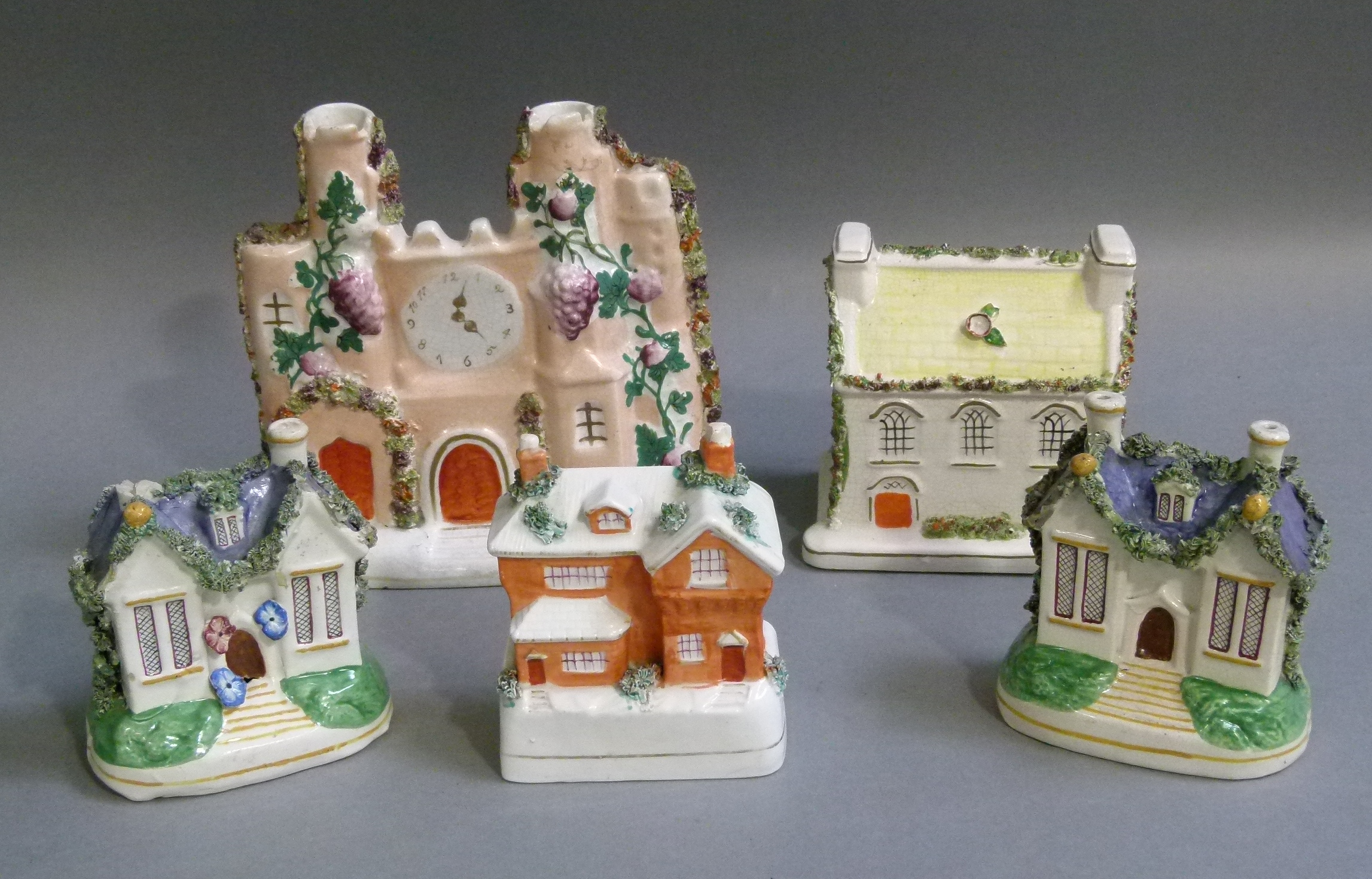 Five Staffordshire cottage ornees, 19cm high and smaller