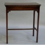 An Edwardian mahogany card table the rectangular top inset with a quartered shaped figured panel