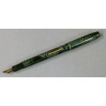 A Skywriter pen by Waterman Co Ltd in green and marbled case with 14k gold nib (clip to lid missing)