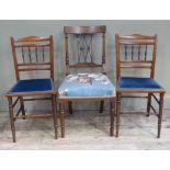 Three chairs comprising one Edwardian inlaid chair on turned legs together with two walnut bedroom