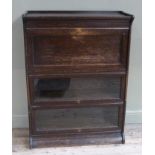 A Globe Wernicke style stacking bookcase made of oak, with fall front desk with six drawers