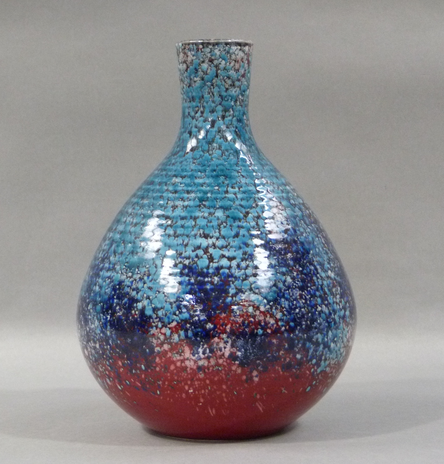 Alan White for Poole Studio, a vase, ovoid with cylindrical neck, mottled glaze in turquoise, blue