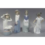 Four Nao porcelain figures, 24cm high and smaller, printed marks in brown (4)