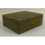 An early 20th century jewellery case by Bramah in green leather with tiered green velvet interior