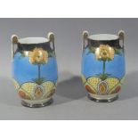 A pair of Nortitake porcelain two handled vase of baluster form decorated with stylised poppies