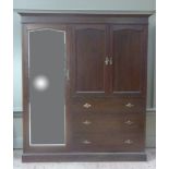 A mahogany combination wardrobe with flared cornice, shallow frieze, arched mirror door to left