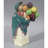 A Royal Doulton figure - The Balloon Seller HN583, 23cm high, printed mark in green titled and