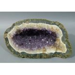 An amethyst part geode, 44cm wide