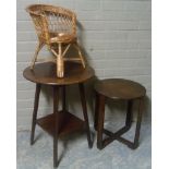 A mahogany two tier table the circular top above splayed square tapered legs with square