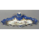 A Crescent China inkwell in Worcester 18th century style the scale blue ground with gilt framed