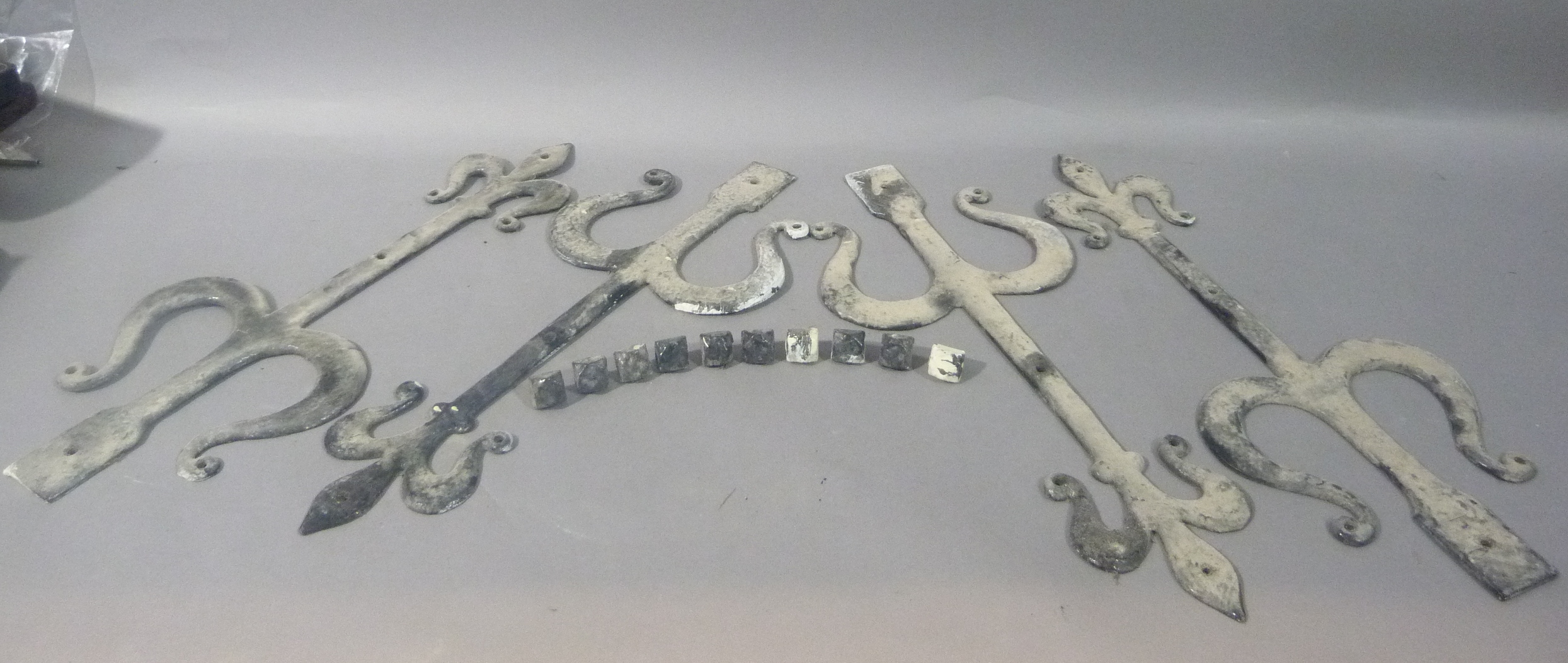 Four wrought iron strapwork hinges painted black, trefoil terminals, 50cm wide approximately - Image 2 of 2