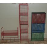 A coloured metal wall shelf, the three tiers with fronts in varying colours numbered 1,2 and 3, a