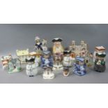 Nine various Toby jugs and Staffordshire cottages and figures