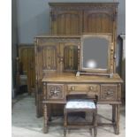 A six piece oak bedroom suite carved with linen fold panelling between lunette carved friezes,