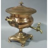 A post Regency copper and brass samovar, shallow fluted lid, compressed body with pair of ivory