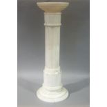 An alabaster pilaster circular top, fluted column, stepped circular base, 80cm high