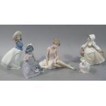 Four Nao figures by Lladro: modelled as young girls and ballet dancer; together with another of a