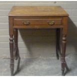 A Victorian single drawer side table, turned legs joined by stretchers, ceramic castors, 65cm wide