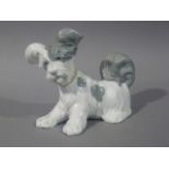 A Lladro figure of a terrier, 18cm wide, printed mark in blue