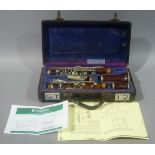 A rosewood Simple System model clarinet with nickel plated fittings, cased