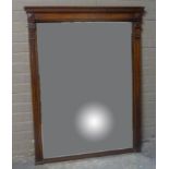 A Victorian walnut overmantel mirror with fluted uprights headed by geometric corbels, 136cm high