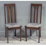 A pair of Edwardian mahogany and satinwood chevron banded rush seated bedroom chairs on square
