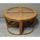 A G Plan circular teak nest of five tables with glass insets to the main table