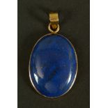 A Lapiz Lazuli pendant, the oval cabochon stone collet set and hung from a pendant loop in yellow