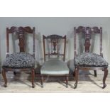 An Edwardian walnut nursing chair and a pair of mahogany dining chairs with moquette upholstery