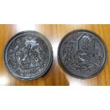 A pair of French pottery relief moulded plates decorated with classical scenes